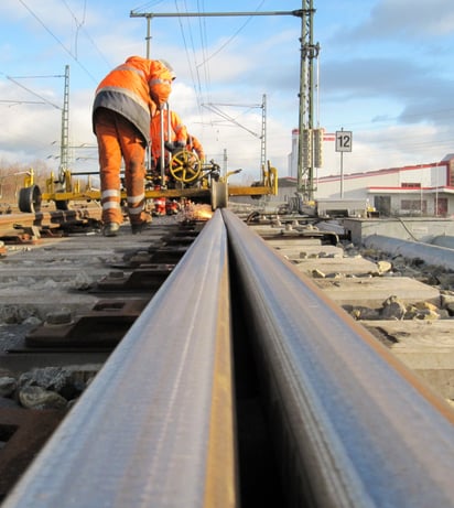 HSG-2 Train, meadow, cloudy sky and wind turbines