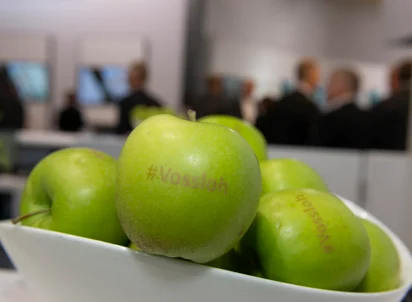 Green apple with Vossloh branding